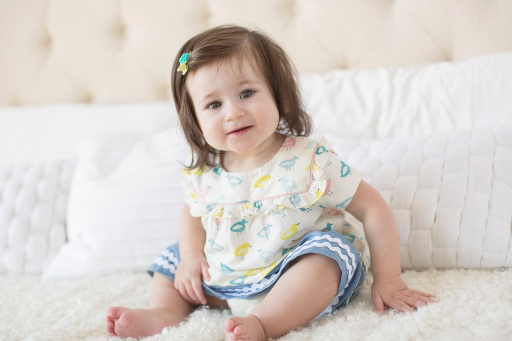 Baby portrait, bird-print dress