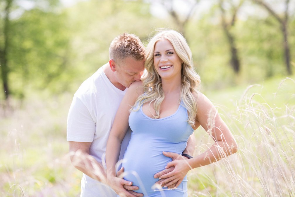 Maternity portrait in a sunlit field